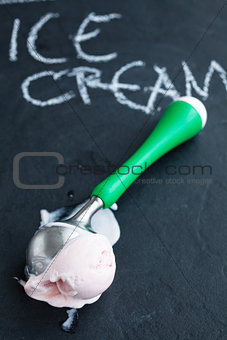 Strawberry ice cream and scoop
