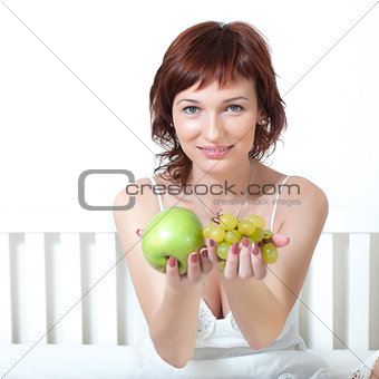 Beautiful young woman with fruit