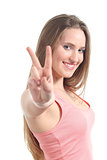 Young beautiful woman making the victory or peace gesture