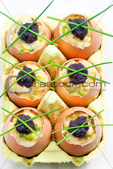 scrambled eggs with chives and black caviar