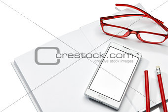 Notebook, phone and glasses