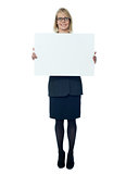 Company secretary holding blank billboard