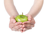 female teen hands holding green apple