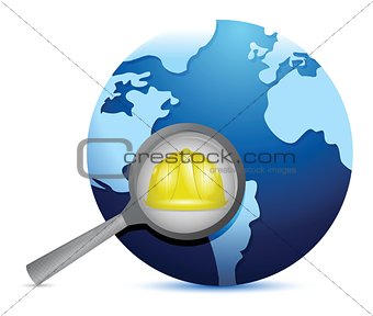 globe and magnify glass under construction
