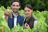young couple proud of their vineyard