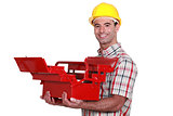Worker with an open toolbox