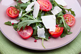 Close up salad with ruccola and tomatoes