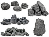 Set of piles of coal isolated on white