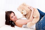 Pretty girl with her teddy bear