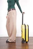 side woman with yellow suitcase