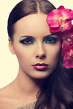 close up of beauty girl with flowers. FAKE FLOWERS 