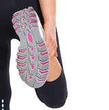 Closeup on sole of stretching fitness woman