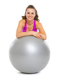 Smiling fitness young woman with fitness ball