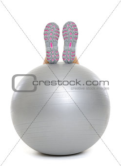 Closeup on leg laying on fitness ball