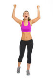 Full length portrait of fitness young woman rejoicing success