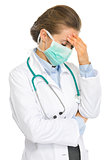 Frustrated medical doctor woman in mask