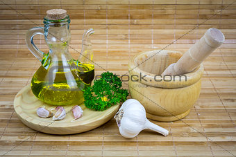 still life with olive oil,vegetables on wood table 