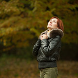 young woman portrait in autumn park 