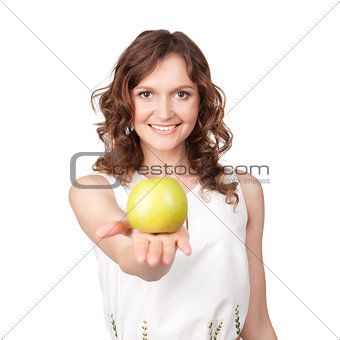 Portrait of young girl which gives of a green apple