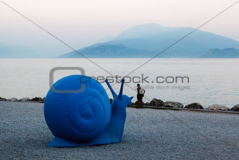 Blue Snail on Lake Garda Beach in Sirmione, Italy
