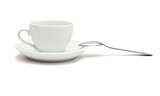 white cup with spoon and saucer