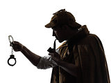 sherlock holmes holding handcuffs silhouette