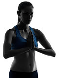 woman exercising yoga portrait meditating hands joined