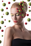 girl with colored spheres on the face