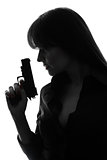 sexy detective  woman holding  gun silhouette
