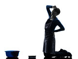 woman maid housework tired backache washing floor silhouette