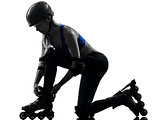 woman tying roller skates  silhouette