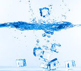Ice Cubes Dropped into Water with Splash