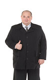 Elegant fat man in a black suit shows thumb-up