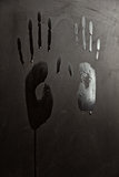 wet hand prints on wall