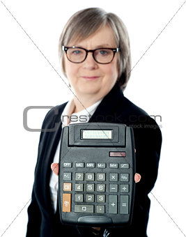 Business professional showing calculator to camera