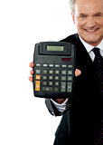 Cropped image of a businessman showing calculator