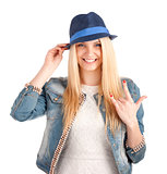 Portrait of young woman in blue hat
