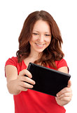 Young woman playing games on tablet