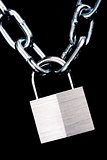 Link Chain Connected By Keyed Steel Locking Padlock on Black