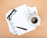 Blank paper with pen, glasses and coffee cup