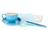 Blue coffee cup and office supplies