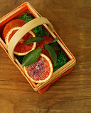 red (bloody) oranges  in a wicker basket