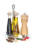 Olive oil, vinegar bottles, pepper shaker and spices