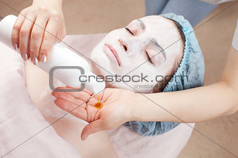 Beautiful woman with clear skin getting beauty treatment of her 
