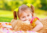 Little girl hugging soft toy