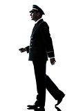 man in airline pilot uniform silhouette walking 