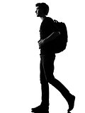 young man silhouette backpacker walking