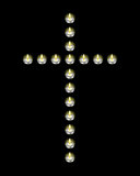 Cross laid out candles