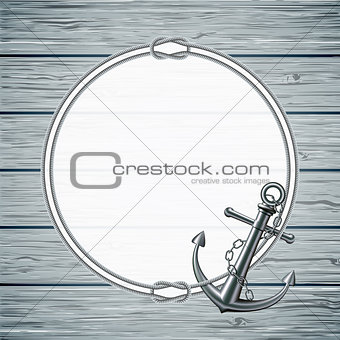 Nautical card with frame of the rope and anchor on wooden background.