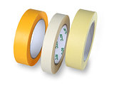 Three rolls of narrow paper tape in white, yellow and brown, iso
